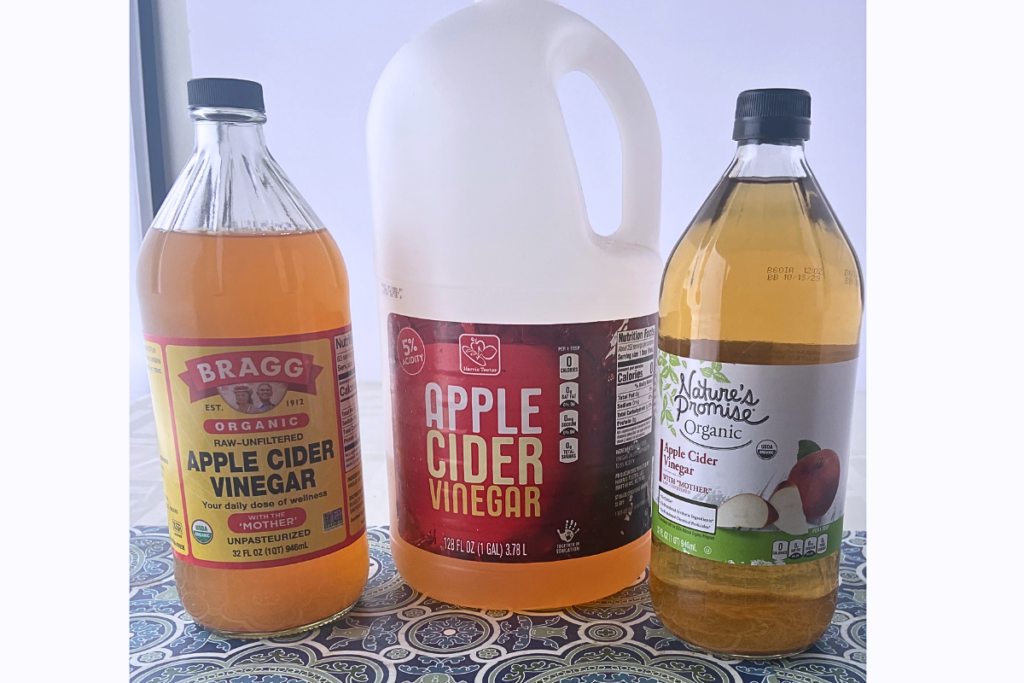 Collection of apple cider vinegar bottles and jugs.