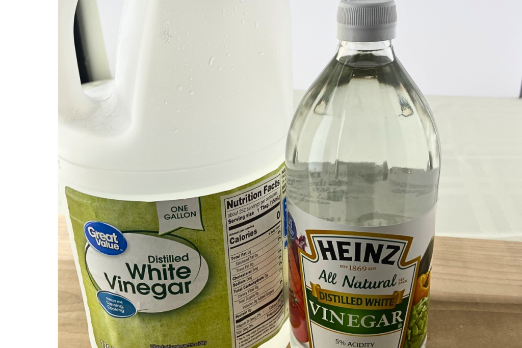 A jug and a bottle of distilled white vinegar