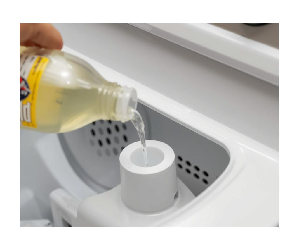 pouring into fabric softener dispenser