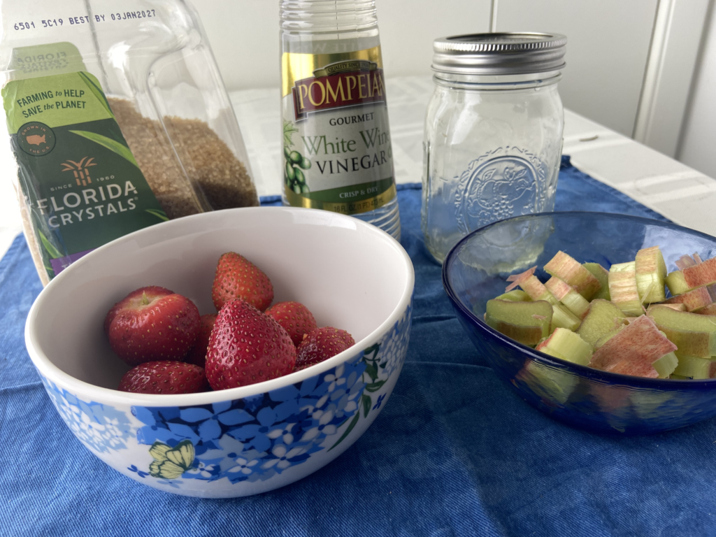 Ingredients displayed for a strawberry rhubarb shrub with white wine vinegar