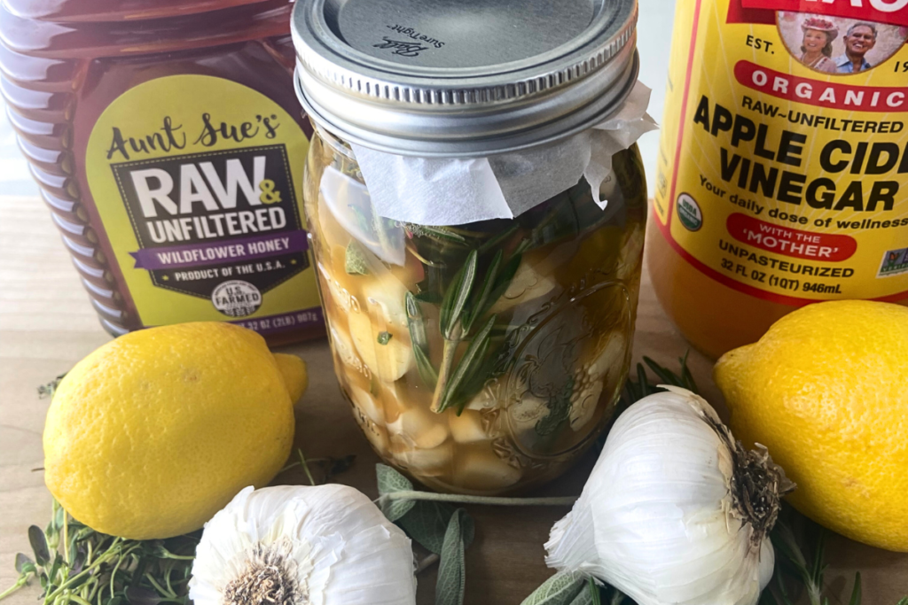 atv oxymel applecidervinegar rawhoney lemon garlic sage closeup v01.webp