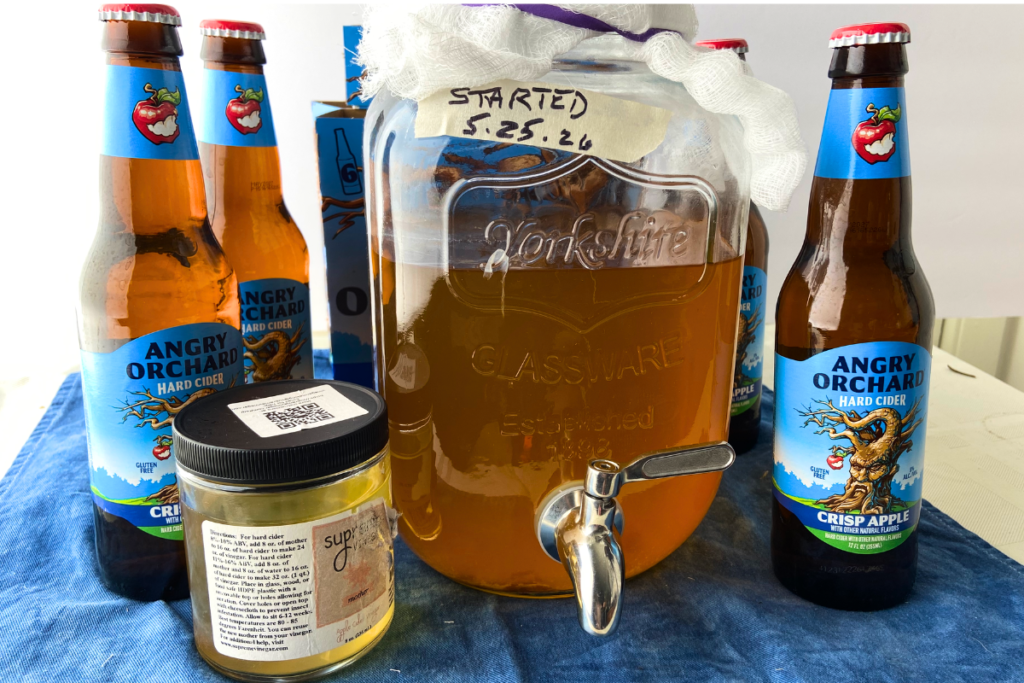 atv food&drink acv hardcider Display of hard apple cider bottles, a jar of apple cider vinegar 