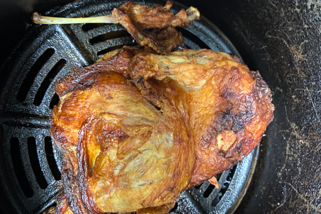 overhead shot of acv marinaded half-chicken cooked in an air fryer