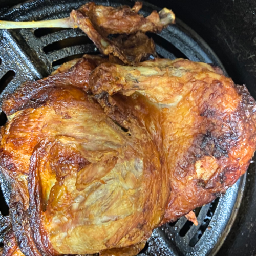 overhead shot of acv marinaded half-chicken cooked in an air fryer