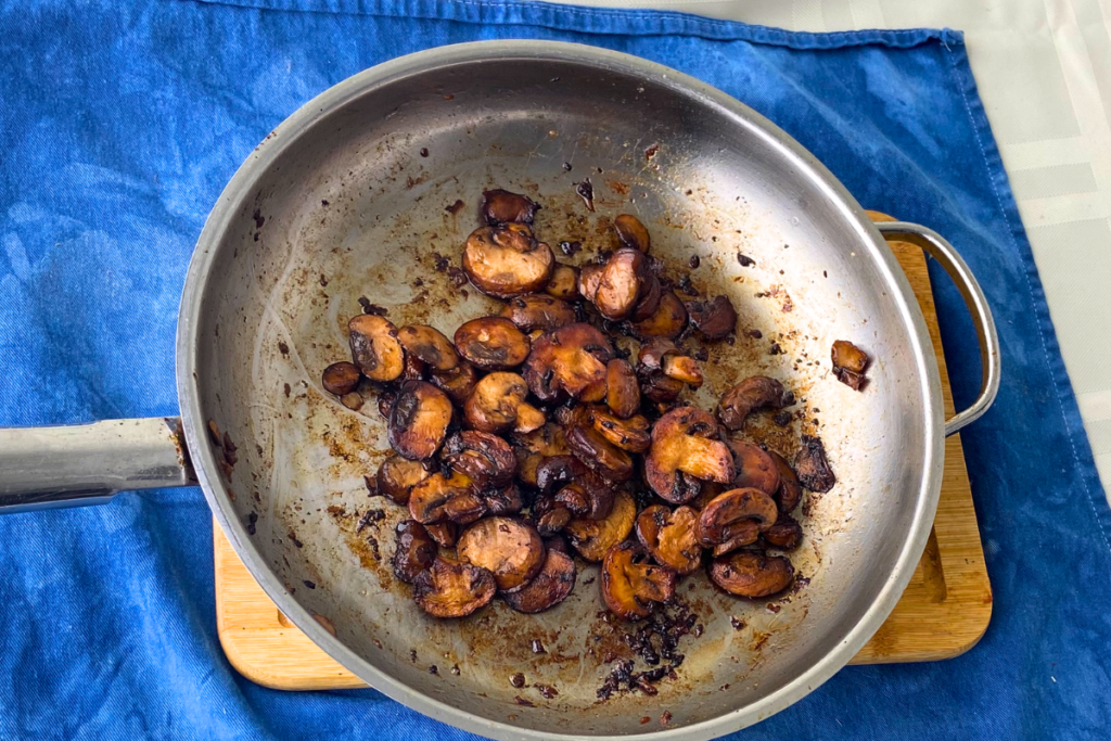 atv food&drink redwinevinegar sauteedshrooms pan overhead