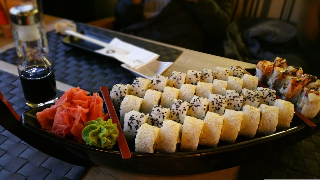 Japanese sushi meal made with sushi rice vinegarin Japanese meal  laid out on a tray with sauce nearby