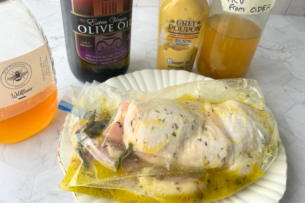 chicken thighs marinating in an autumn vinegar marinade in storage bags